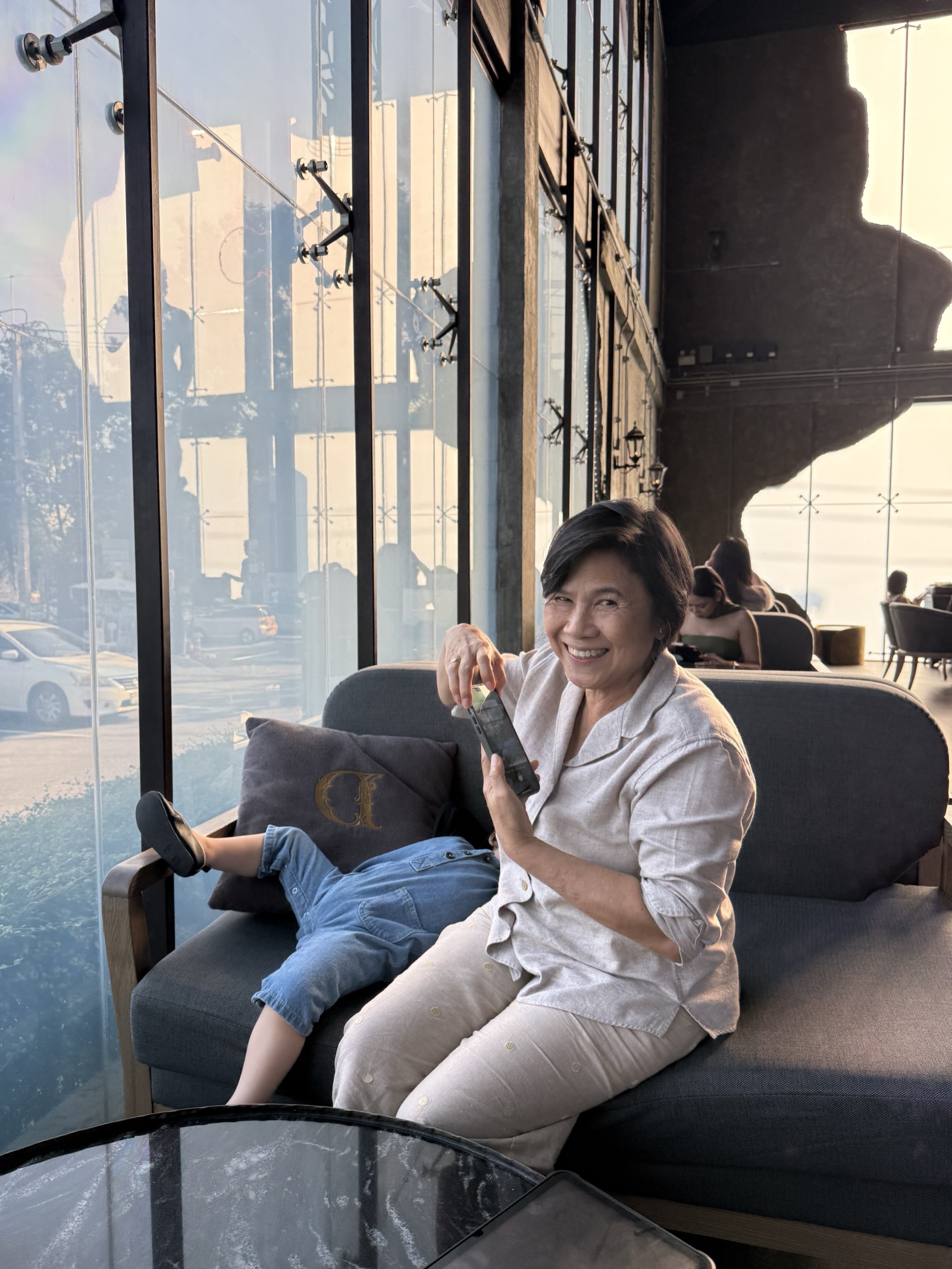 Mommy Moo, founder of Mommy Signage, smiling in Bangkok