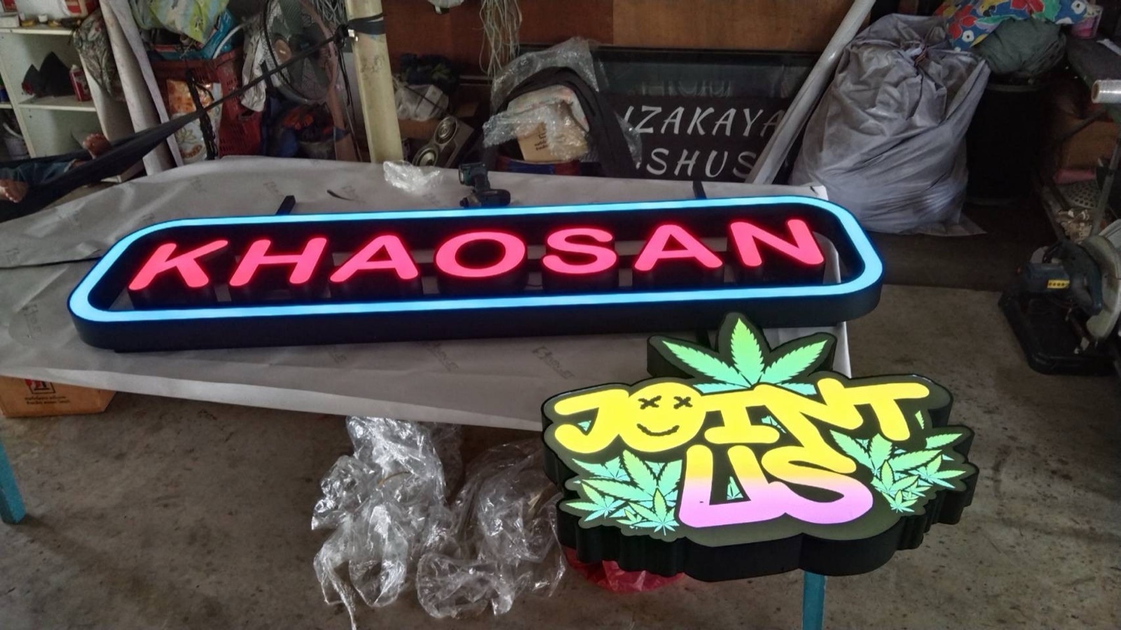 Khaosan and Joint Us neon-look LED lightbox signs in the Mommy Signage workshop