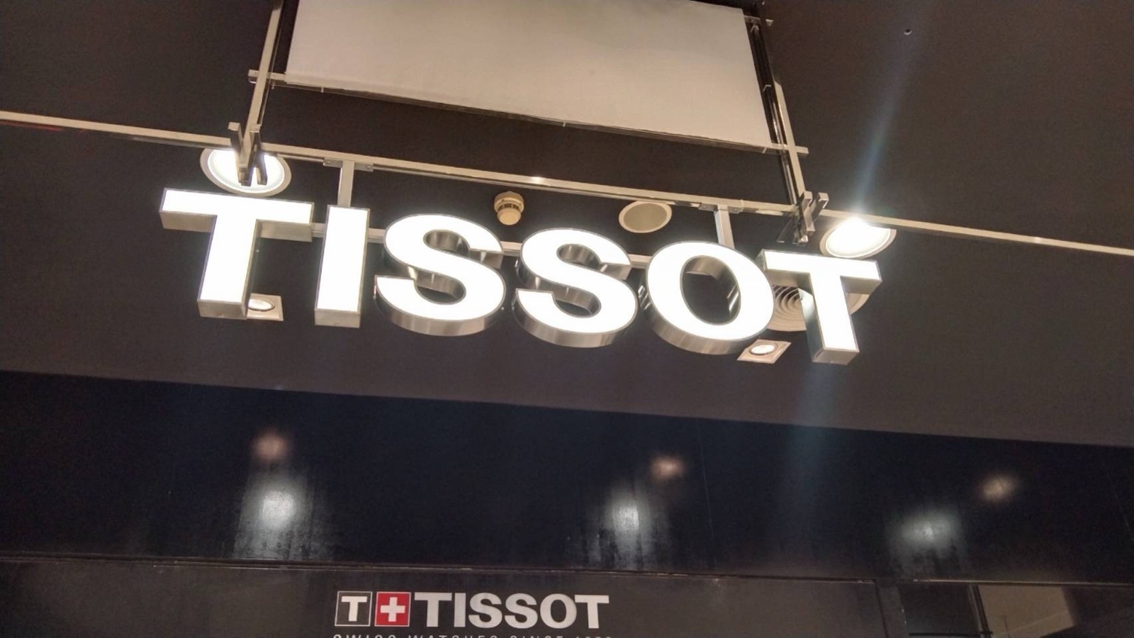 Tissot stainless built-up letters at a storefront — made by Mommy Signage